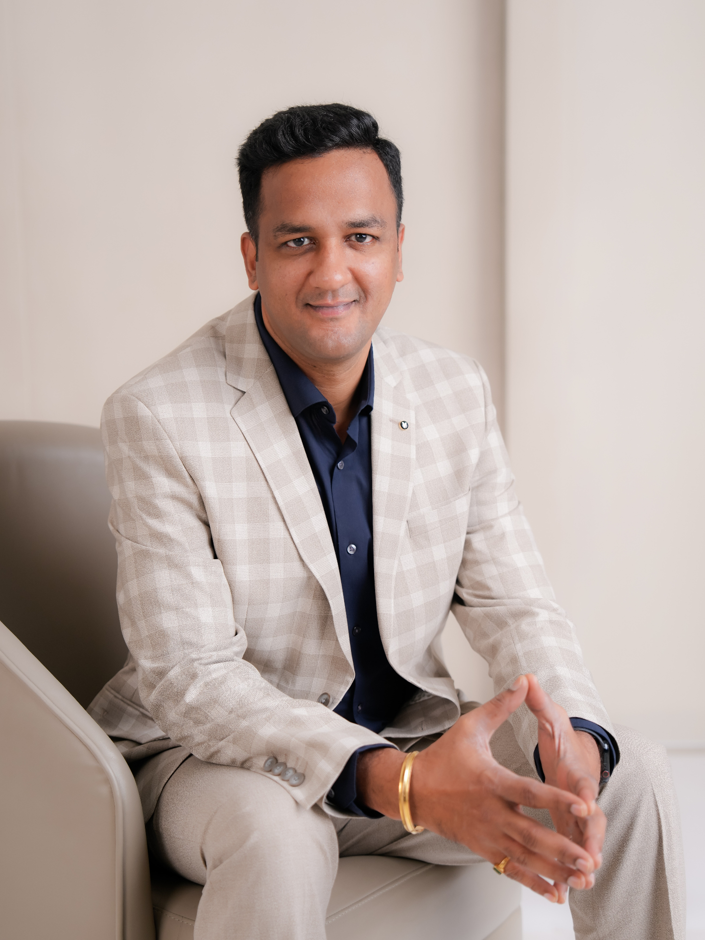 Coach Dhejo seated portrait